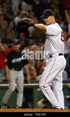 Boston Red Sox pitcher Jonathan Papelbon points to shortstop Alex Cora for making the second out of the ninth inning against the Toronto Blue Jays at Fenway Park in Boston on August 31, 2006. Boston won the game 6-4. (UPI Photo/Katie McMahon) Stock Photo