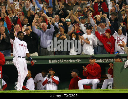 Boston Red Sox designated hitter David Ortiz rounds the bases after hitting  his 50th home run of the season off Minnesota Twins pitcher Boof Bonser  during the sixth inning at Fenway Park