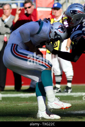 Miami Dolphins quarterback Joey Harrington gets sacked by New England Patriots defensive lineman Jarvis Green at Gillette Stadium in Foxboro, Mass. on October 8, 2006. Green was called for a face mask penalty on the play. (UPI Photo/Katie McMahon) Stock Photo