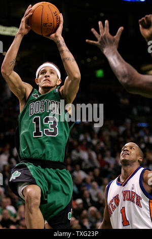 Boston Celtics guard Delonte West (13) gets a shot on net while New York Knicks guard Steve Francis (1) looks on during the second period of the game at the TD Banknorth Garden in Boston on November 24, 2006.  (UPI Photo/Matthew Healey) Stock Photo