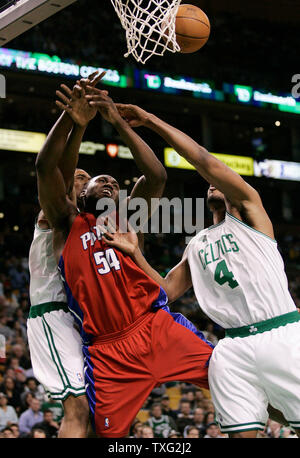 Detroit Pistons forward Jason Maxiell (54) battles for a loose ball with Boston Celtics forward Ryan Gomes (4) and rookie forward Leon Powe in the second half at the TD Banknorth Garden in Boston on April 18, 2007.  Maxiell drew a loose ball foul. The Pistons defeated the Celtics 91-89. (UPI Photo/Matthew Healey) Stock Photo