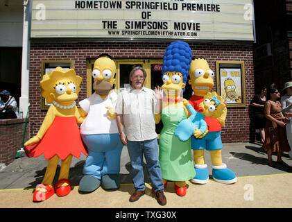 'The Simpsons Movie' producer Matt Groening (C) waves to the crowd while lined up with the characters from his television show and movie at the hometown premier of The Simpsons Movie at the Springfield Movie Theater in Springfield, Vermont on July 21, 2007.  From left are Lisa Simpson, Homer Simpson, Matt Groening, Marge Simpson, Maggie Simson, and Bart Simpson.  (UPI Photo/Matthew Healey) Stock Photo