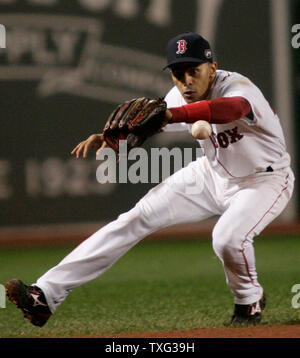 Boston Red Sox shortstop Julio Lugo throws to first baseman Kevin