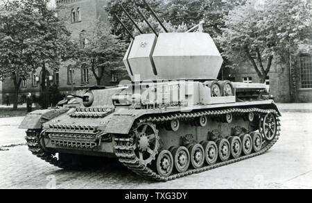 German quadruple anti-aircraft guns called Flakvierling 38 (four Flak 38 mounted in one artillery piece only) and mounted on a tank. 1943 Stock Photo