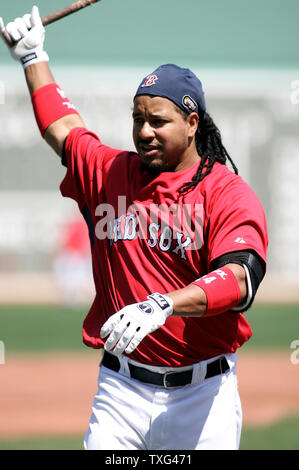 Boston Red Sox left fielder Manny Ramirez stretches before batting