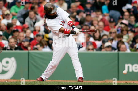 Boston Red Sox's Manny Ramirez (24) connects for a single in the fourth inning against the Kansas City Royals at Fenway Park in Boston, Massachusetts on May 22, 2008.  (UPI Photo/Matthew Healey) Stock Photo