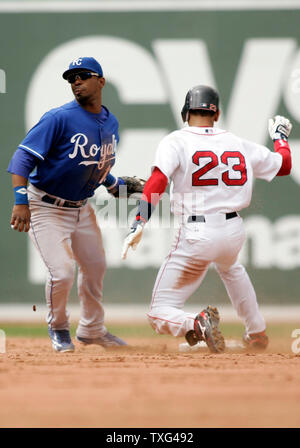 Boston Red Sox's Julio Lugo (23) is caught stealing by Kansas City Royals shortstop Alberto Callaspo (13) and Kansas City Royals catcher Miguel Olivo (21) (not pictured) in the second inning at Fenway Park in Boston, Massachusetts on May 22, 2008.  (UPI Photo/Matthew Healey) Stock Photo