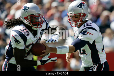 Tom Brady of the New England Patriots runs against Dre''Bly of the