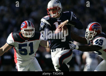 New England Patriots quarterback Matt Cassel (16) charges past Buffalo Bills linebacker Paul Posluszny (51) and safety Bryan Scott (43) for a first quarter touchdown at Gillette Stadium in Foxborough, Massachusetts on November 9, 2008. (UPI Photo/Matthew Healey) Stock Photo