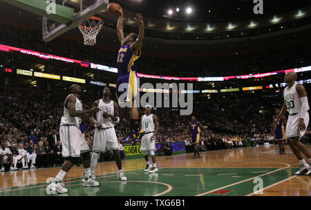 Los Angeles Lakers guard Shannon Brown (12) goes for a dunk as Celtics players Kendrick Perkins (43), Kevin Garnett (5) and Ray Allen (20) look on in the second half at the TD Garden in Boston, Massachusetts on January 31, 2010.  The Lakers defeated the Celtics 90-89.   UPI/Matthew Healey Stock Photo