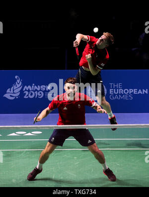 Great Britain's Marcus Ellis (right) and Chris Langridge (left) on their way to winning their Group B Mens Badminton Doubles match against Estonia's Kristjan Kaljurand and Raul Kasner, during day five of the European Games 2019 in Minsk. Stock Photo