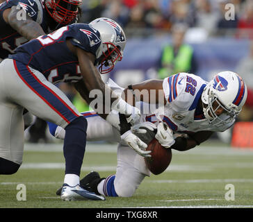 Buffalo Bills running back Fred Jackson (22) fumbles the ball after being hit by New England Patriots cornerback Devon McCourty (32) on the New England Patriots 1-yard line in the fourth quarter at Gillette Stadium in Foxboro, Massachusetts on November 11, 2012.  UPI/Matthew Healey Stock Photo