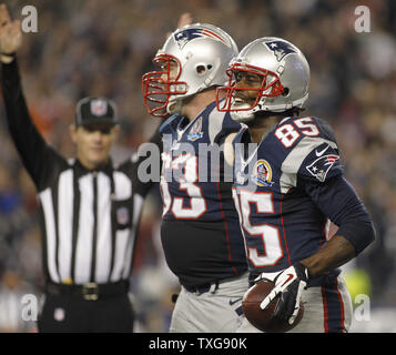 Brandon Lloyd of the New England Patriots recovers a fumble by  New  england patriots football, Patriots football, New england patriots