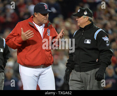 Boston Red Sox manager John Farrell watches from the dugout steps ...