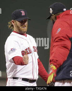 Boston Red Sox closing pitcher Koji Uehara (19) celebrates with catcher  Jarrod Saltalamacchia, right, after the Red Sox beat the Seattle Mariners  11-8 in a baseball game, Tuesday, July 9, 2013, in