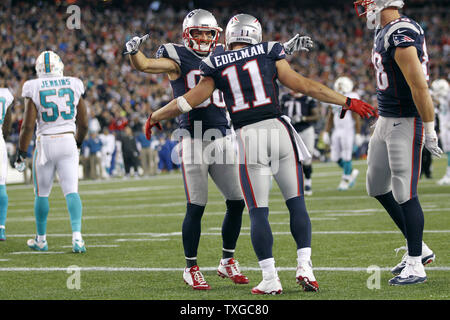 New England Patriots wide receiver Julian Edelman (11) is congratulated by wide receiver Danny Amendola (80) after Edelman's a 16-yard touchdown reception in the fourth against the Miami Dolphins at Gillette Stadium in Foxborough, Massachusetts on October 29, 2015.  The Patriots defeated the Dolphoins 36-7.   Photo by Matthew Healey/ UPI Stock Photo