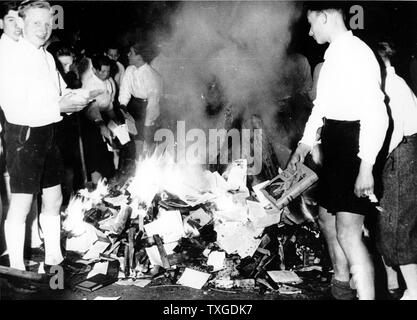 Photograph of Hitler Youth members burning books. Dated 1938 Stock Photo