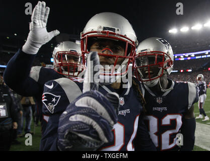 New England Patriots cornerback Stephon Gilmore (C) and Devin McCourty (R)  celebrate 24-20 win over the Jacksonville Jaguars in the AFC Championship  game at Gillette Stadium in Foxborough, Massachusetts on January 21,