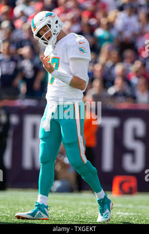 September 30, 2018: Miami Dolphins wide receiver Danny Amendola (80) has a  laugh with former teammate New England Patriots linebacker Kyle Van Noy  (53) after the NFL game between the New England