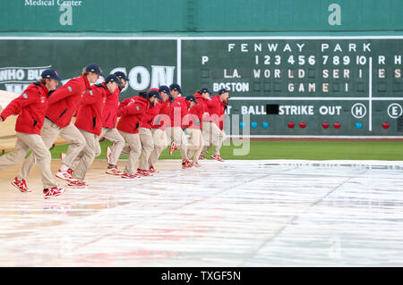 TarpGuy gets pulled under when grounds crew rolls field cover at Royals game