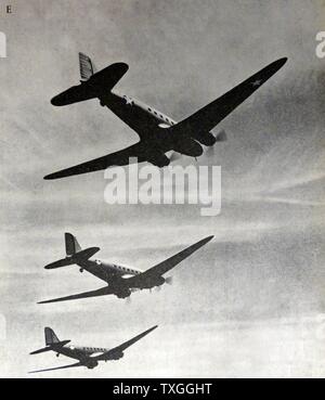 Three planes readying to bomb an archipelago. Douglas R4D bombers, all flying in tight formation. Stock Photo