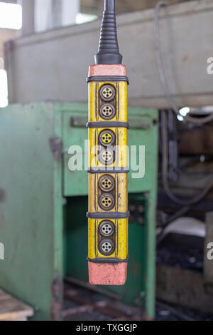 Movement remote control pendant switch for overhead crane Stock Photo