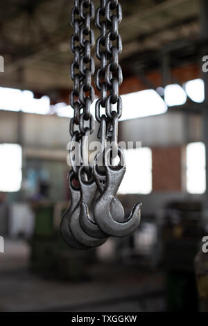 Old black steel chain and hooks Stock Photo