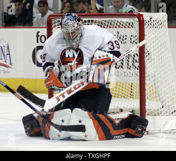 New York Islanders goalie Rick DiPietro makes a stick save in the second period against the Buffalo Sabres at the HSBC Arena in Buffalo, New York on April 14, 2007.  The Islanders defeated Buffalo 3-2 to even the series, one game apiece. (UPI Photo/Jerome Davis) Stock Photo
