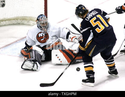 New York Islanders goalie Rick DiPietro (39) stops Buffalo Sabres defenseman Brian Campbell (51) at point blank range in the third period at the HSBC Arena in Buffalo, new York  on April 14, 2007.  The Islanders defeated Buffalo 3-2 to even the series, one game apiece. (UPI Photo/Jerome Davis) Stock Photo