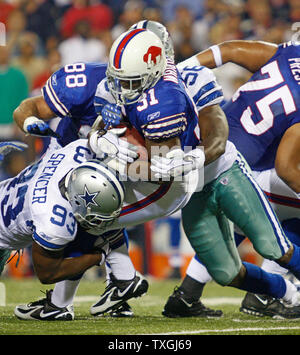 Buffalo Bills running back Dwayne Wright (31) is stopped short of a first down by Dallas Cowboys defensive end Anthony Spencer (93) and linebacker Bradie James (56) in the second quarter at Ralph Wilson Stadium in Buffalo, New York on October 8, 2007.  The Cowboys defeated the Bills 25 - 24.    (UPI Photo/Jerome Davis) Stock Photo