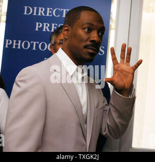 Actor and comedian Eddie Murphy waves to photographers on his way to the press conference for 'Shrek 2' at the Palais des Festivals May 15, 2004 during the Cannes Film Festival in Cannes, France.  (UPI Photo/Christine Chew) Stock Photo