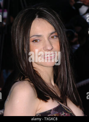 French actress Beatrice Dalle poses for photographers on the red