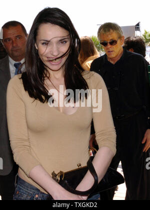 Beatrice Dalle and Nick Nolte(right) make their way to the press conference for 'Clean' at the Palais des Festivals May 21, 2004 during the Cannes Film Festival in Cannes, France. (UPI Photo/Christine Chew) Stock Photo