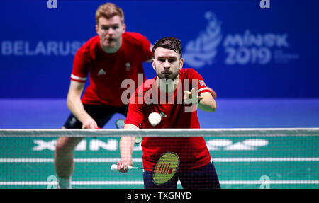 Great Britain's Marcus Ellis (left) and Chris Langridge (right) on their way to winning their Group B Mens Badminton Doubles match against Estonia's Kristjan Kaljurand and Raul Kasner, during day five of the European Games 2019 in Minsk. Stock Photo