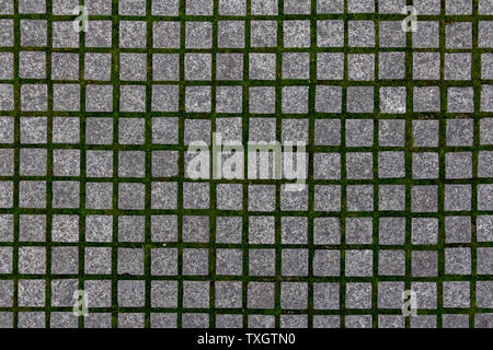 Old cobblestone tile texture in old town. City pavement background. Abstract granite stone brick pattern. Street sidewalk texture Stock Photo