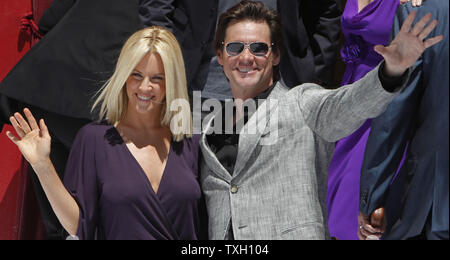 Actress Jenny McCarthy and actor Jim Carrey arrive at a photocall for the film 'A Christmas Carol' at the 62nd annual Cannes Film Festival in Cannes, France on May 18, 2009.   (UPI Photo/David Silpa) Stock Photo