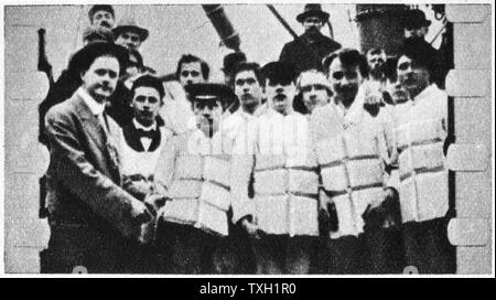 The loss of SS Titanic, 14 April 1912: Members of the ship's crew in their life jackets.  Operated by the White Star Line, SS Titanic struck an iceberg in thick fog off Newfoundland. She was the largest and most luxurious ocean liner of her time, and thought to be unsinkable.  In the collision five of her watertight compartments were compromised and she sank. Out of the 2228 people on board, only 705 survived.  A major cause of the loss of life was the insufficient number of lifeboats she carried. Stock Photo