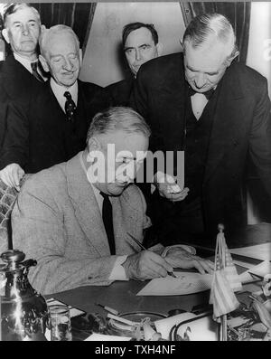 Franklin Delano Roosevelt, 32nd President of the United States of America (1933-1945), signing the declaration of war against Germany, 11 December 1941. Stock Photo