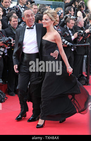 Thierry Ardisson (L) and Audrey Crespo-Mara arrive on the red carpet before the screening of the film 'Lawless' during the 65th annual Cannes International Film Festival in Cannes, France on May 19, 2012.  UPI/David Silpa Stock Photo