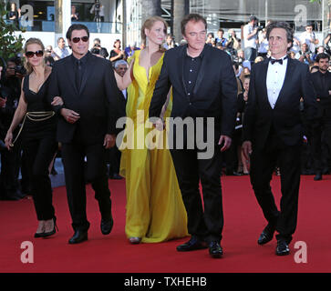 (From L to R) Kelly Preston, John Travolta, Uma Thurman, Quentin Tarantino and Lawrence Bender arrive on the red carpet before the screening of the film 'Clouds of Sils Maria' during the 67th annual Cannes International Film Festival in Cannes, France on May 23, 2014.  UPI/David Silpa Stock Photo