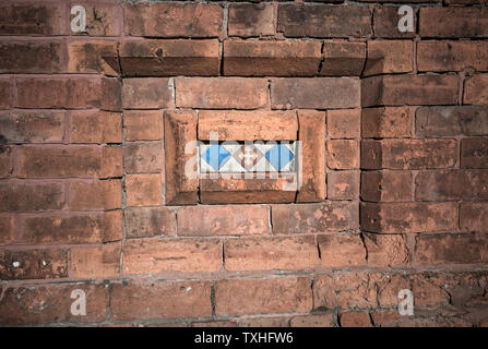 Victorian decorative  red brick tiled motif inlay. Stock Photo