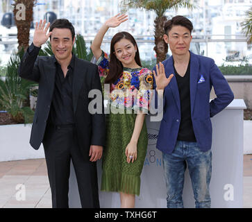 Sung-Woo Bae (L), Ah-Sung Ko and Won-Chan Hong arrive at a photocall for the film 'O Piseu (Office)' during the 68th annual Cannes International Film Festival in Cannes, France on May 19, 2015.   Photo by David Silpa/UPI Stock Photo
