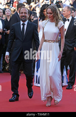 Asghar Farhadi and Lily-Rose Depp arriving on the red carpet of Les ...