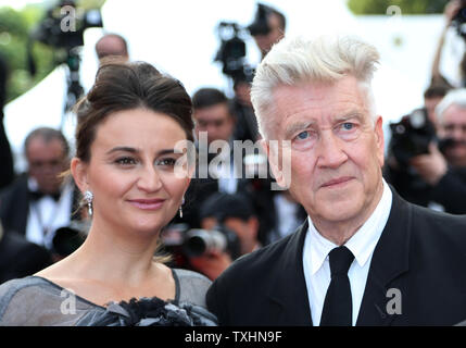 Emily Stofle (L) and David Lynch arrive on the red carpet before the screening of 'Twin Peaks' during the 70th annual Cannes International Film Festival in Cannes, France on May 25, 2017.  Photo by David Silpa/UPI Stock Photo