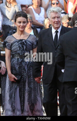 Emily Stofle (L) and David Lynch arrive on the red carpet before the screening of 'Twin Peaks' during the 70th annual Cannes International Film Festival in Cannes, France on May 25, 2017.  Photo by David Silpa/UPI Stock Photo