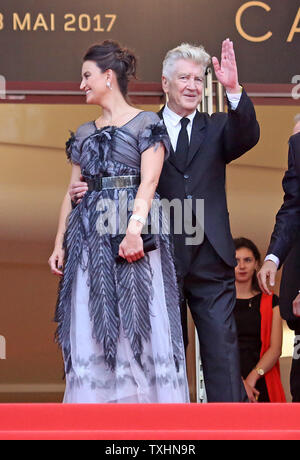 Emily Stofle (L) and David Lynch arrive on the red carpet before the screening of 'Twin Peaks' during the 70th annual Cannes International Film Festival in Cannes, France on May 25, 2017.  Photo by David Silpa/UPI Stock Photo