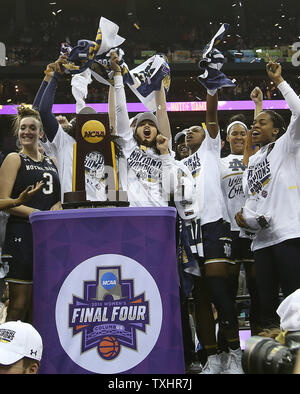 Ohio State players celebrate with the trophy after defeating Nebraska ...