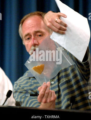 Bill Gerstenmaier, Associate Administrator of Space Operations at NASA, shows the actual foam that broke off the Space Shuttle Discovery external tanks during press conference at Kennedy Space Center in Cape Canaveral, Florida on July 3, 2006.  He announce that the launch of STS-121 will go on as scheduled for July 4, 2006.     (UPI Photo/Pat Benic) Stock Photo