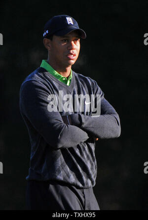 Tiger Woods waits to putt on the sixth green during the second round of