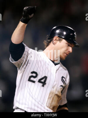 Chicago White Sox's Joe Crede, left, gets a cleat to the neck as Baltimore  Orioles' Miguel Tejada completes a double play that caught Crede and Ross  Gload out in the fifth inning